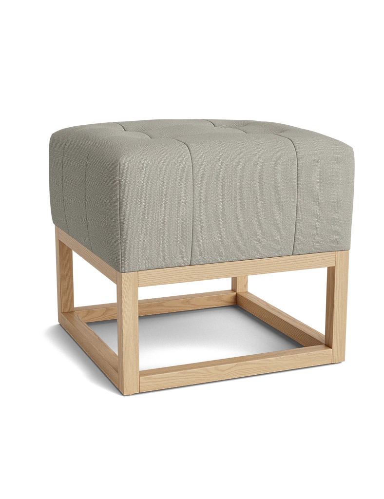 Stone tufted square ottoman with a light wood frame.